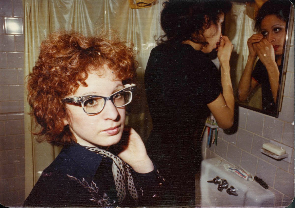 Nan in the bathroom with roommate Boston (Photo courtesy of Nan Goldin)